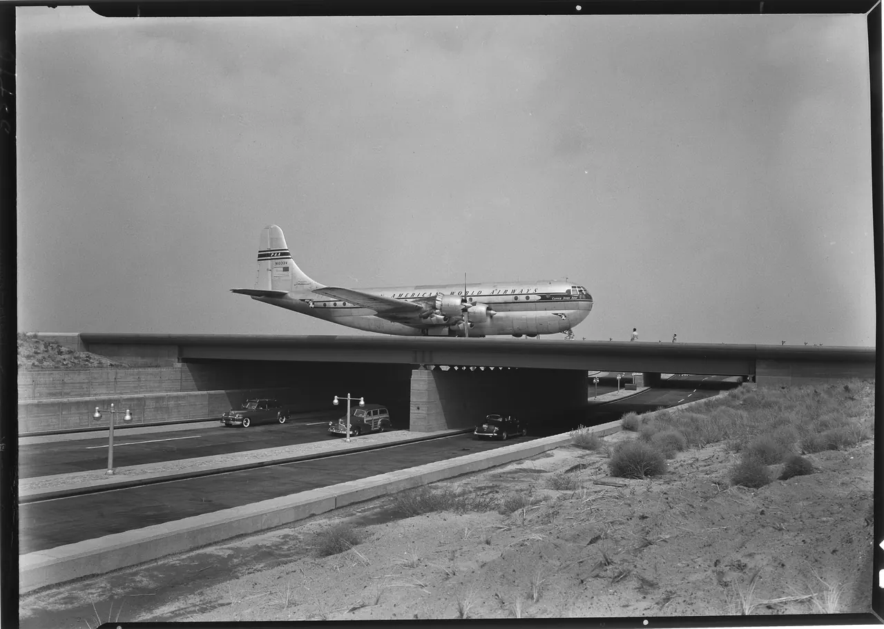 A Pan American Stratocruiser crossing the Van Wyck Expressway overpass at New York International Airport, Idlewild